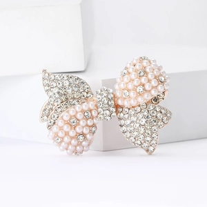 Elegant rose gold alloy bow brooch with white pearls and sparkling zircons for women