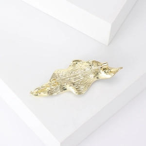 Elegant gold enamel leaf brooch with pearl and unique hammered metal texture finish