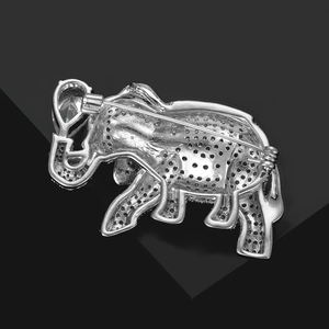 Macro view of the silver elephant brooch back with micro-set stones and sturdy pin fastener