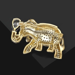 Macro view of the elephant brooch back showing detailed stone settings and safety pin clasp