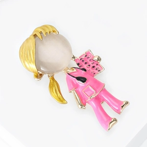 Detail of creative nurse brooch featuring pink enamel finish and round opal stone