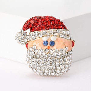 Close-up of Santa Claus brooch featuring sparkling red rhinestones and alloy base