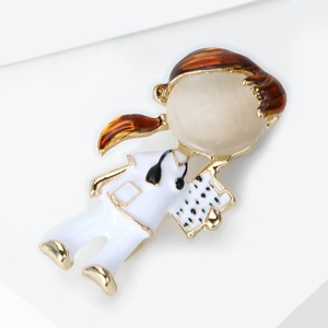 Macro shot of nurse brooch with cat-eye stone face and detailed stethoscope on medical coat