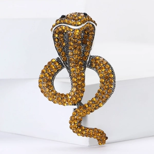 Vintage cobra brooch featuring yellow rhinestones set in a silver alloy frame for suits