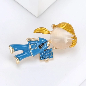 Detailed shot of a nurse brooch with gold alloy finish and white cat eye stone