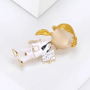 Detailed close-up of a golden alloy nurse brooch with opal stone and white enamel finish