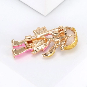 Detail view of the secure pin clasp and gold-plated alloy back of the cartoon brooch