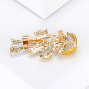 Detail view of the gold-plated nurse brooch back showing the pin closure mechanism