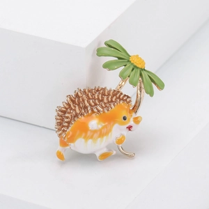 Detail of hedgehog brooch holding a daisy umbrella with colorful enamel finish