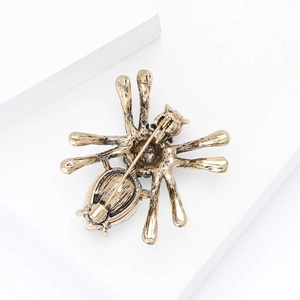 Close-up of the vintage spider brooch back view showing metal texture and pin fastener