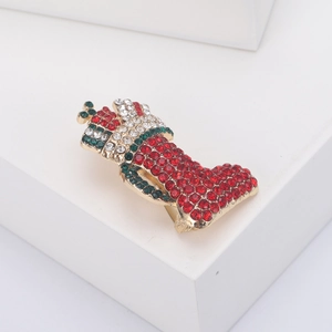 Christmas boot brooch with red and green rhinestones on a gold alloy holiday pin