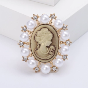 Vintage gold-plated cameo brooch with female silhouette, white pearls and sparkling crystals