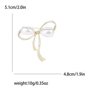 Élégante broche nœud dorée avec perles blanches et strass, dimensions 5,1x4,8 cm