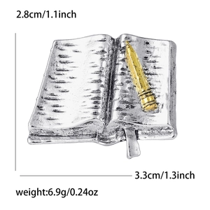 Detail view of book and brush brooch showing measurements 2.8cm height and 3.3cm width