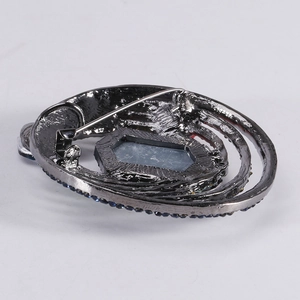 Retro gunmetal alloy oval brooch with deep blue rhinestones and crystal back view