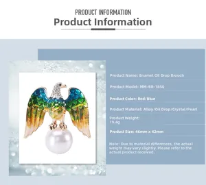 Macro view of vintage eagle brooch with enamel wings, rhinestone head and faux pearl