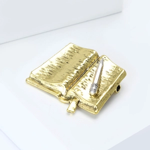 Creative vintage open book brooch with silver pencil pin for apparel decoration