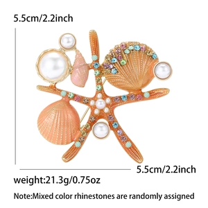 Broche étoile de mer orange avec coquillages, perles et strass colorés