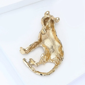 Detail of the golden leopard brooch reverse side showing the secure pin closure mechanism