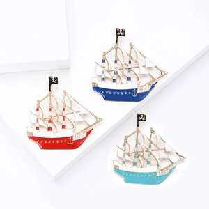 Enamel nautical sailboat brooch set in red and blue shades with skull flag detail