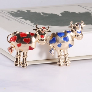 Cute golden cow brooch pins with colorful enamel heart spots for creative fashion accessories