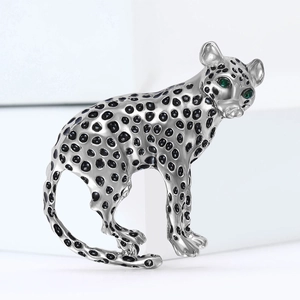 Elegant silver cheetah brooch with black enamel spots and green gemstone eyes for accessories