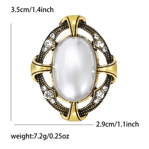 Broche perle vintage avec cadre doré en dentelle ajourée et cristaux, hauteur 3.5 cm