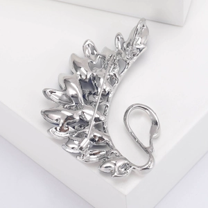 Detail view of silver swan brooch back with secure pin clasp and blue crystal inlays