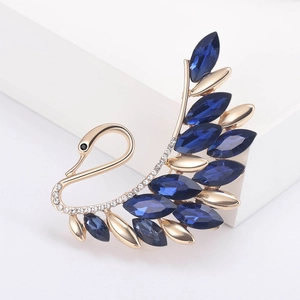 Elegant crystal swan brooch pin with deep blue gemstones and gold finish for suit jackets
