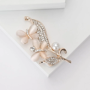 Elegant rose gold butterfly brooch with opal wings, pearls and sparkling rhinestones