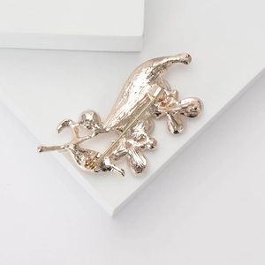 Detail view of the gold-plated metal pin closure and backing of the butterfly brooch