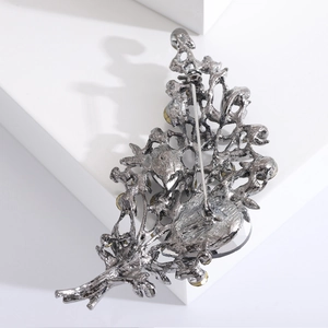 Vintage floral crystal brooch in gunmetal grey with yellow beads and safety pin closure
