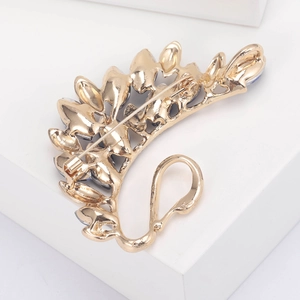 Back view of elegant gold crystal swan brooch with secure metal pin clasp and alloy finish