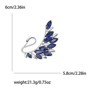 Elegant silver swan brooch with dark blue crystal gems and sparkling rhinestones