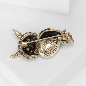 Vintage owl brooch with antique gold plating and crystal accents, rear view
