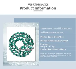 Macro detail of enamel brooch showing size 40mm and green rhinestone wreath design
