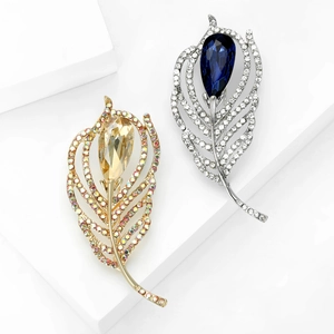 Elegant feather brooches with champagne and blue crystals in gold and silver plating