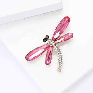 Elegant gold-tone dragonfly brooch with pink crystal wings and sparkling rhinestones