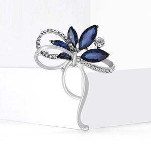Broche fleur et nœud élégante en argent avec pierres bleu marine et cristaux fins