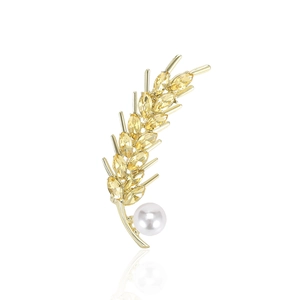 Détail de la luxueuse broche épis de blé avec cristaux jaunes et perle blanche