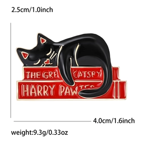 Cute black cat enamel pin lying on books with Harry Pawter and Catsby puns