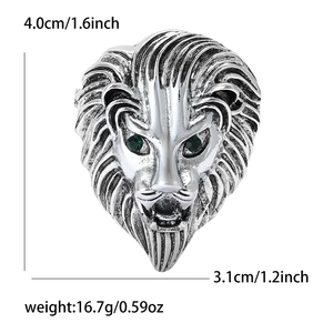Detailed view of silver lion head brooch with green eyes and product dimensions