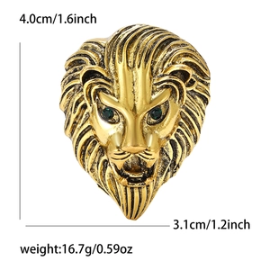Lion head brooch in gold alloy with green stone eyes and precise size measurements