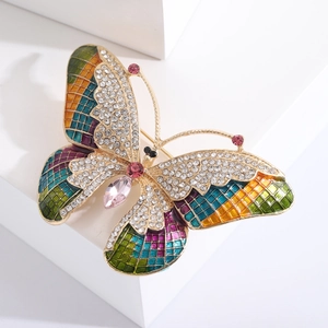 Elegant butterfly brooch in gold-plated metal with colorful enamel and sparkling crystals