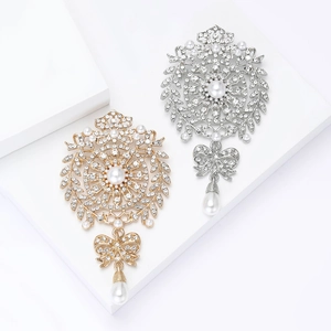 Elegant rhinestone wheat bow brooch with pearl drop pendant in gold and silver finish