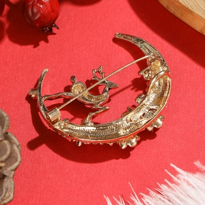 Christmas reindeer moon brooch pin with gold alloy finish and secure needle clasp