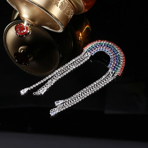 Rainbow rhinestone tassel brooch with colorful crystals and silver chain fringe in macro view