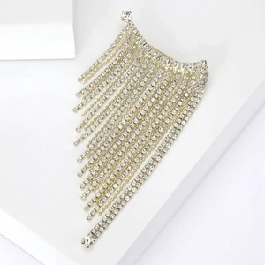 Macro shot of tiered cascading diamond fringe brooch with sparkling crystal rhinestones