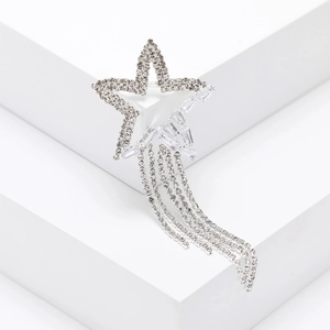 Sparkling crystal star brooch with elegant tassel chains on a clean white background