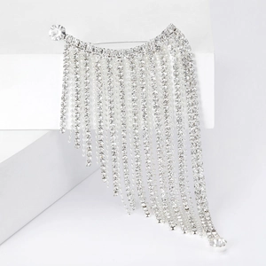 Elegant silver tassel brooch with sparkling rhinestones on a minimalist white display